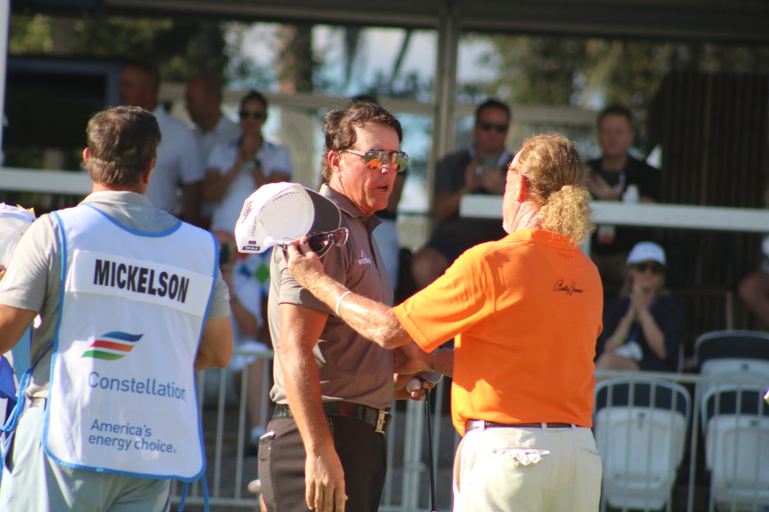 Mickelson and runner-up Miguel Angel Jimenez of Spain shake hands on the 18th green after the event. The two battled for the top spot down the stretch.
